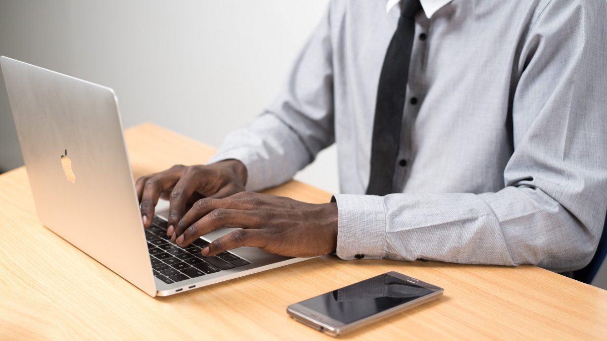 person typing on a laptop